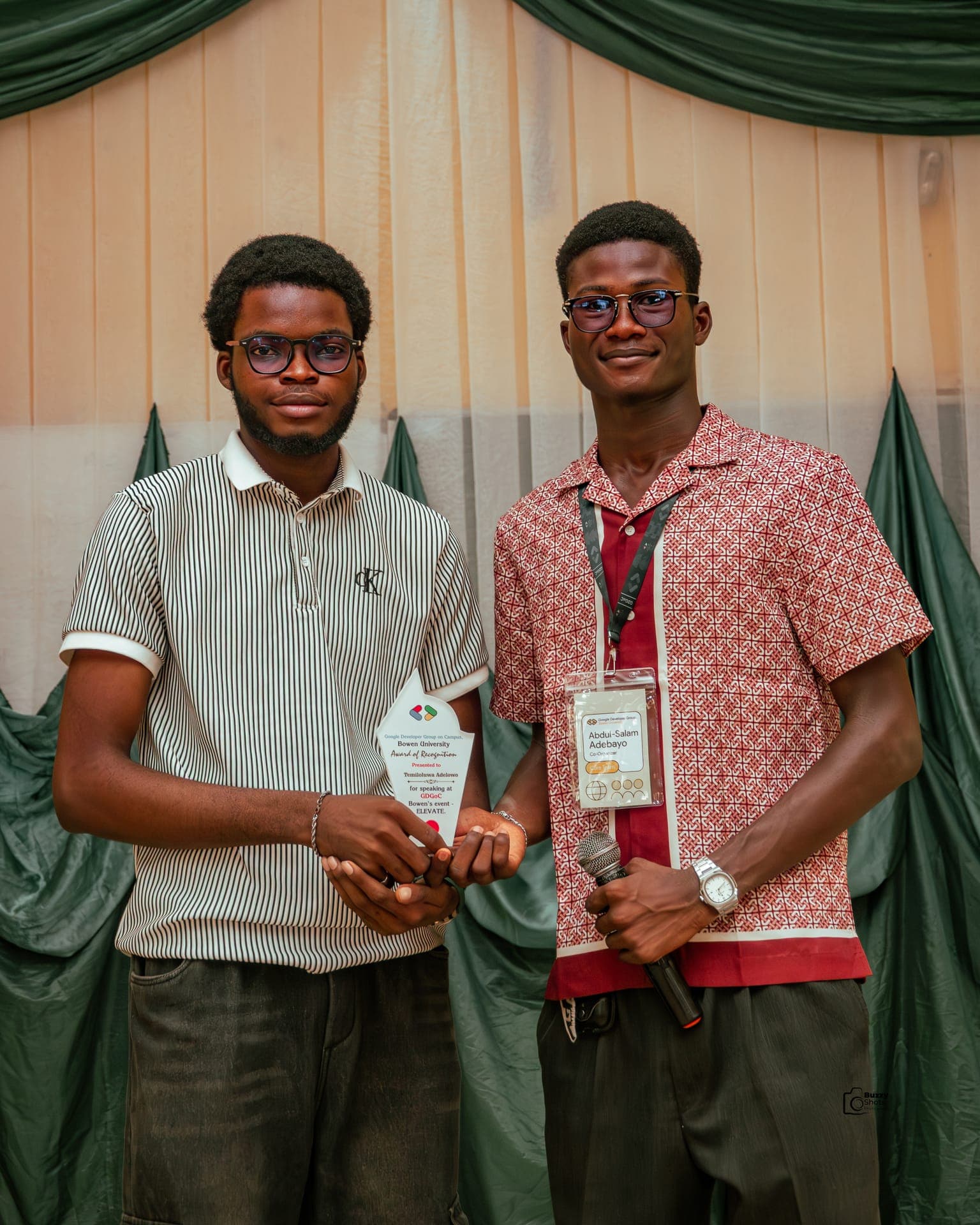 Abdul-Salam receiving an award of recognition on stage